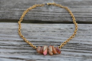 Gold necklace with red stones