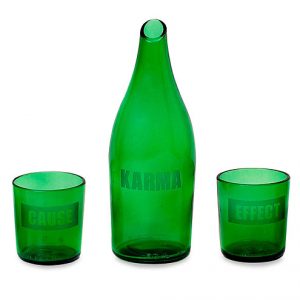 Glass and carafe set with "cause", "effect", and "karma" written on them